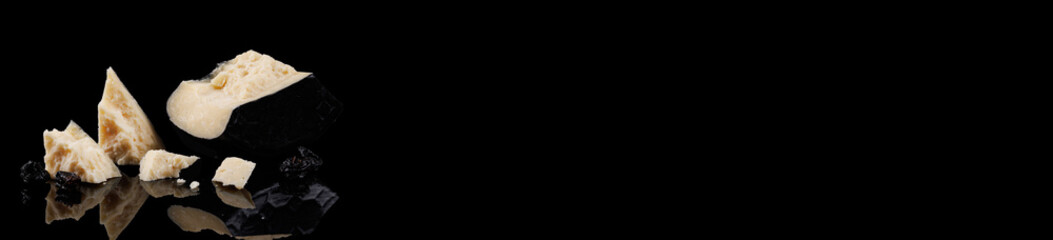 Banner. hard Dumbo cheese with prunes. Black background with reflection