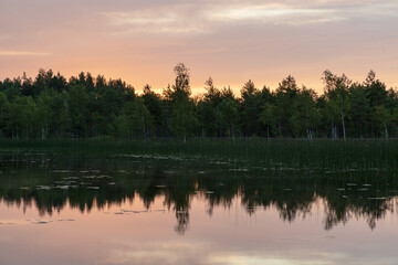 Fototapeta na wymiar Lake in the forest in Latgale region, Latvia. Sunset, reflection. Wallpaper, background