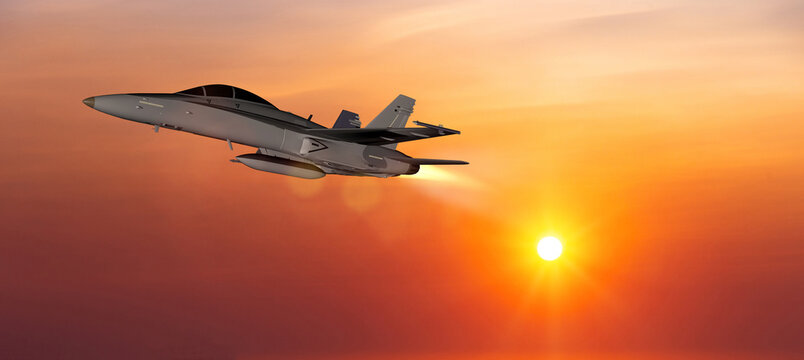 Military aircraft flying on a sunset sky background