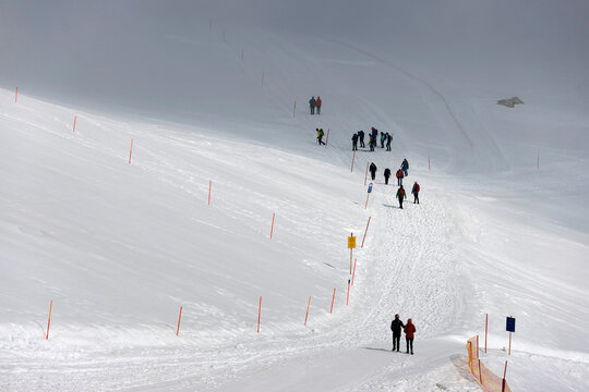 People walking on Dachstein Glacier. Dachstein mountain station of the Schladming-Dachstein cable car in Austria, Europe. 