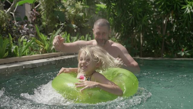 Family spending time in the pool