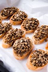 Italian bruschetta with fried mushrooms and onions.