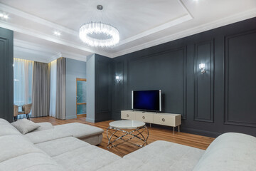 A luxurious living room in a neoclassical mansion. Beautiful room decor, stylish .furniture.
