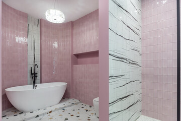 Bathroom with an exclusive design, decorated in the art style. The room is decorated with pink and...