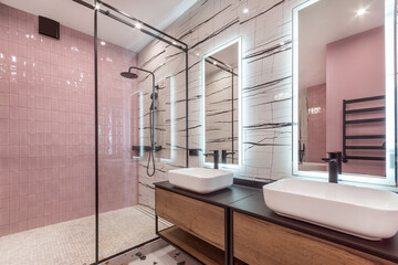 Exclusive design of the bathroom, decorated in the art style. Stylish accessories, .a shower behind a glass partition.