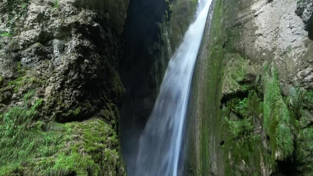 Panoramic aerial view of Chute de la Druise Waterfall. This is a large waterfall on the river Gervanne, located in Drôme, in the Auvergne-Rhône-Alpes region