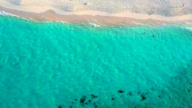 Cinematic aerial veiw of beautiful ocean coastline with turquoise water in Bahamas, Nassau. Drone footage of georgeus beach with white. Paradise Beach aerial view on Island. High quality 4k footage