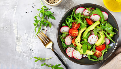 Diet menu. Healthy salad of fresh vegetables - tomatoes, avocado, arugula, radish and seeds on a bowl. Vegan food. Flat lay. Banner. Top view - obrazy, fototapety, plakaty