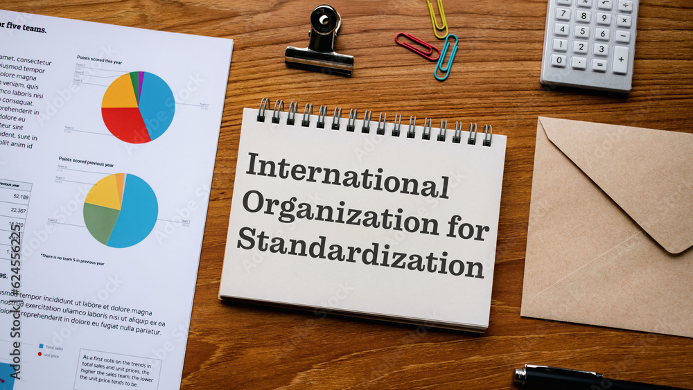 Poster there is notebook with the word international organization for standardization. it is as an eye-catc