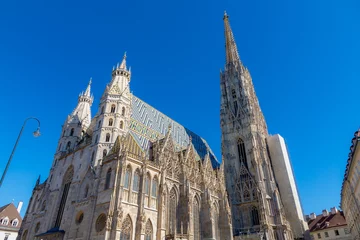Deurstickers Cityscape view of St. Stephen's Cathedral under blue sky, The mother church of the Roman Catholic Archdiocese of Vienna and the seat of the Archbishop of Vienna, Christoph Cardinal Schönborn, Austria. © Sarawut