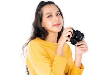 Young beauty Asian woman using camera to take photo and she wearing a yellow sweater shot isolated on white background