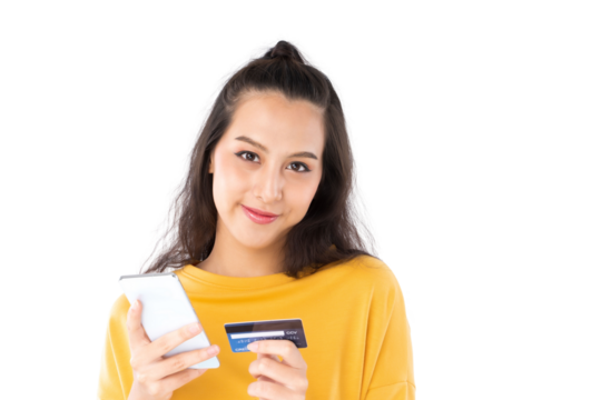 Young beauty Asian woman shopping payment online with credit card on smartphone and she wearing a yellow sweater and looking on camera shot isolated on white background