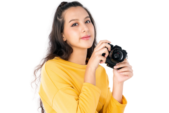 Young beauty Asian woman using camera to take photo and she wearing a yellow sweater shot isolated on white background