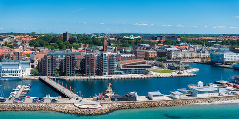 View of the Helsinborg city centre and the port of Helsingborg in Sweden. Old town by the beach and...