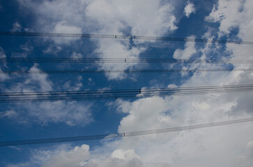 High electrical transmission line  and blue sky background