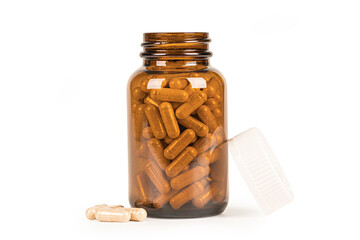 Supplement product in amber bottle on white background.