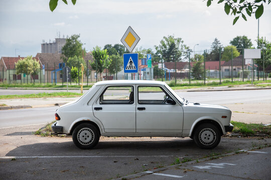 RUMA, SERBIA - JUNE 25, 2023: Selective blur on white Zastava Yugo 55 car Called Skala it's generic name for a family of vintage cars built by Serbian manufacturer Zastava Automobili based on Fiat 128