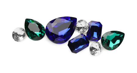 Fototapeta premium Different beautiful gemstones for jewelry isolated on white, top view