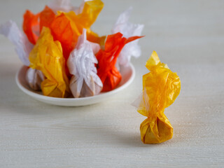 Coconut milk toffee in colorful packaging. Traditional Thai Crunchy Nut Candy. Close up