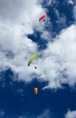 Paragliders flying together over the municipality of Cocorna, Antioquia. Colombia