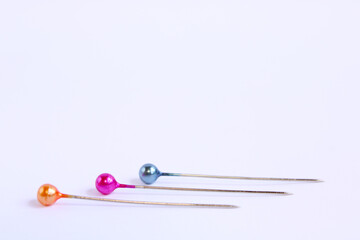 Colorful Sewing Pins On White Background