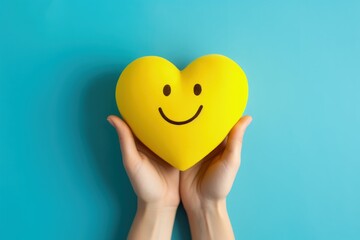 Hand holding heart shaped smiley emoji isolated on blue background, Generative AI