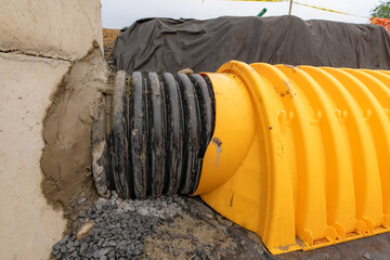 Yellow underground storm water detention mitigation units on a construction site ready to be...