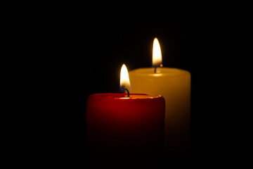 Candle flame in the darkness, hope and memory