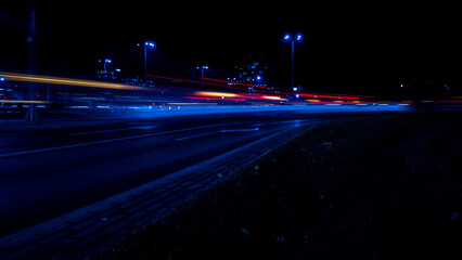 Lights of cars at night. Street line lights. Night highway city. Long exposure photograph night...