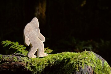 Stone Bigfoot Carving White on moss