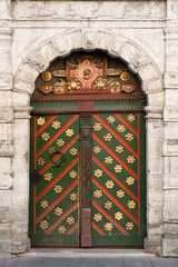 Door to the 'House of the Brotherhood of Blackheads' (16th century), one of key medieval guilds in...