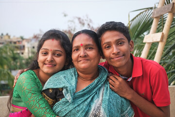 South asian hindu religious mother with her daughter and son 
