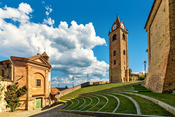 Small church, belfry and open air amphitheater in small town of Monforte d'Alba, Italy. - obrazy, fototapety, plakaty