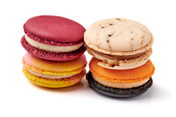 4 colorful macarons (pink, red, orange and cream-brown) isolated on white background.