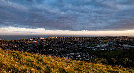sunset over the field view of the city Folkestone