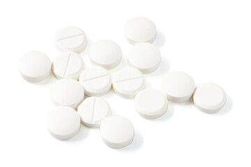 Top view of Many Circle-shaped white pills isolated on a white background.