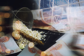 The concept of the cost of grain. 5000 ruble banknotes around a handful of ground grain. World hunger.