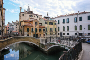 Venice, Italy - June 22, 2023: Canal, bridge and ancient houses of Venice