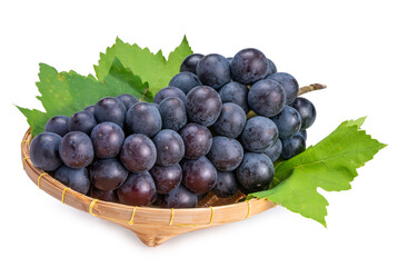 Organic black grapes in  Bamboo basket, Fresh Kyoho Grape isolate on white background with clipping path.