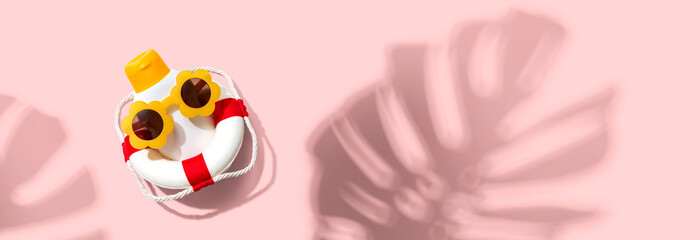 Summer sunblock sunscreen skincare theme with liferaft and tropical leaf shadow