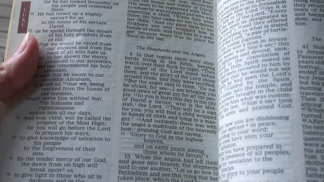 The passage on Luke chapter 1 of the bible that talks about the Messiah is born. Panning, close up view.