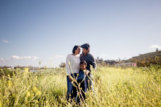 Asian Family of Three Standing in Wildflower Field in San Diego