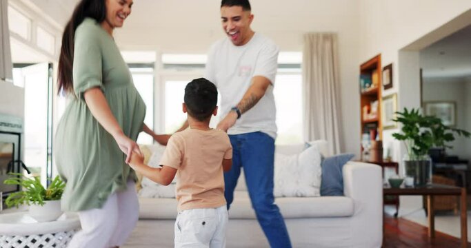 Family, happy and dance with child in home, bonding and having fun time together. Smile, kid and father and mother moving to music, celebration and excited, holding hands and energy in living room