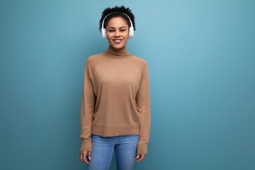 isolated background, cute young brunette hispanic woman freelancer listening to music in bluetooth...