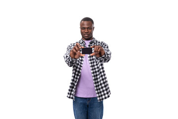 nice young american guy with short hair dressed casually holding credit plastic card mockup