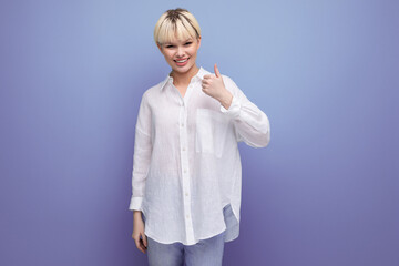 young blonde secretary woman dressed in a white shirt gesticulates in different directions with her...