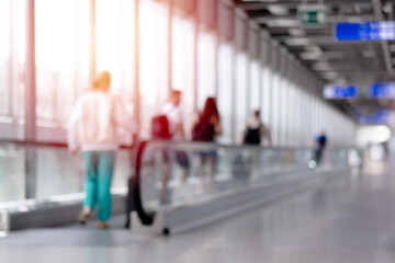 Walkway in modern airport terminal blur for background.