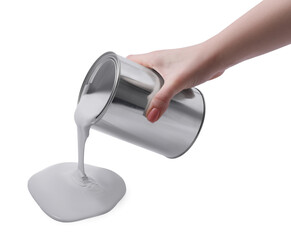Woman pouring paint from can on white background, closeup