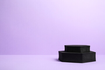 Black geometric figures on violet background, space for text. Stylish presentation for product