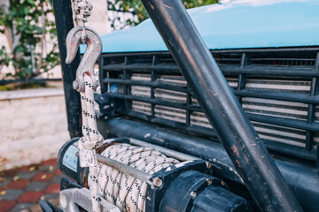 Winch system on an offroad vehicle car ready for outdoor adventure © EdNurg